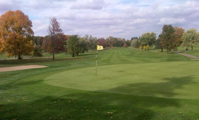 A fall day view of a hole at Elms Country Club.