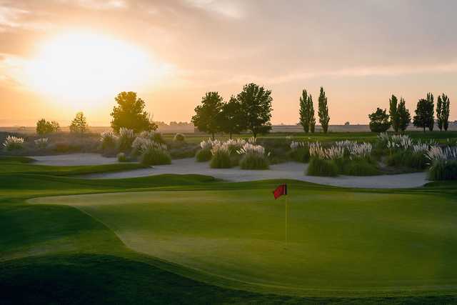 A sunset view of a green from The Reserve at Spanos Park.