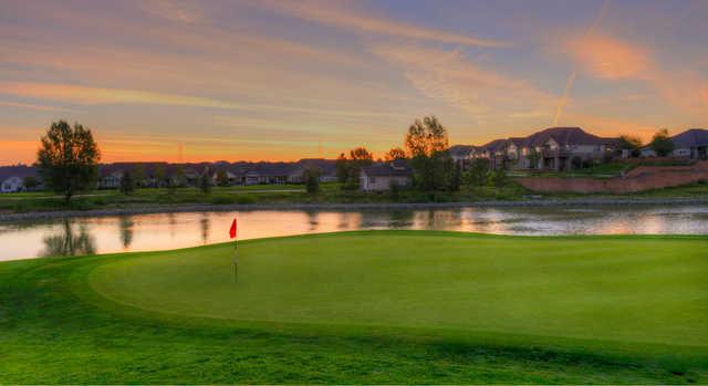 A sunset view of a green at Heritage Eagle Bend Golf Club.