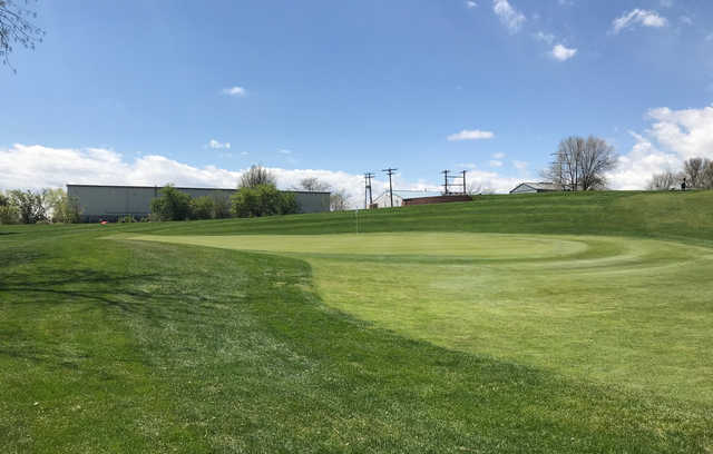 A spring day view of a hole at Broken Tee Englewood Golf Course.
