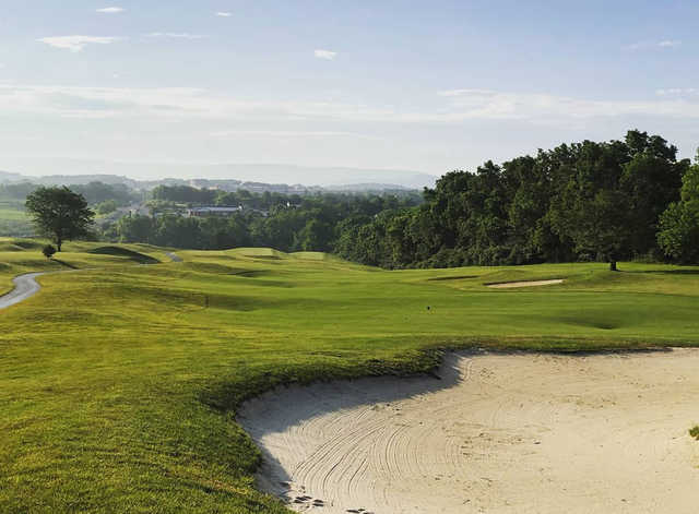 A sunny day view of a fairway at Blue Ridge Shadows Golf Club.