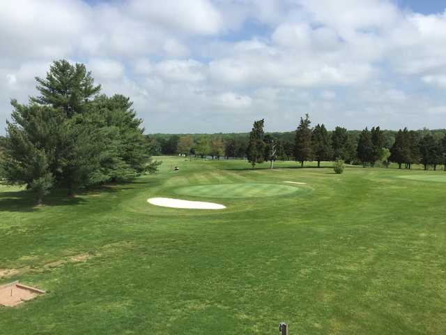 A sunny day view of a hole at Sterling Park Golf Club.