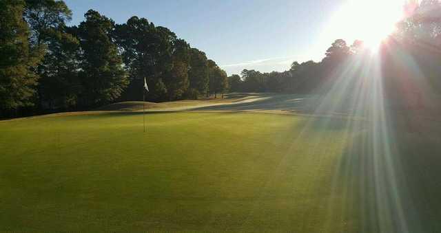 A sunny day view of a green at Kiln Creek Golf Club & Resort.