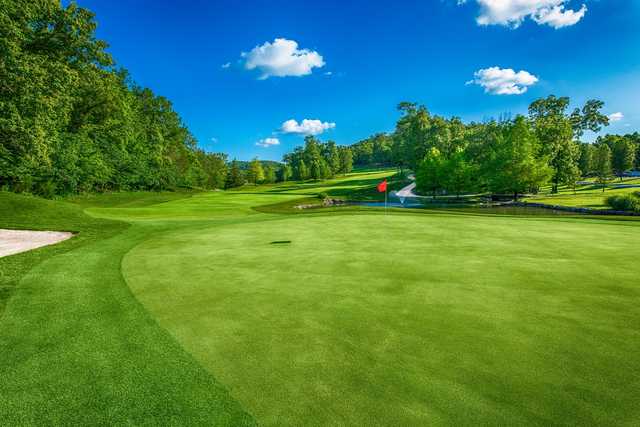 A sunny day view of a hole at LedgeStone Country Club.