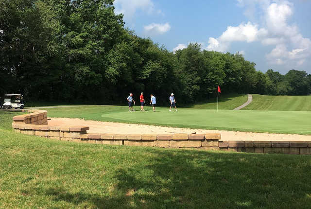 A sunny day view of a green at Flatbush Golf Course.