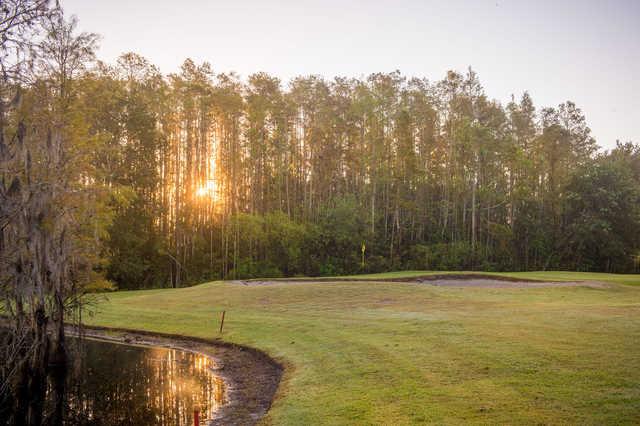 A view of a hole guarded by a tricky bunker at Wentworth Golf Club.