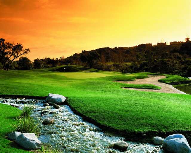 A sunset view of a green at Coyote Hills Golf Course.