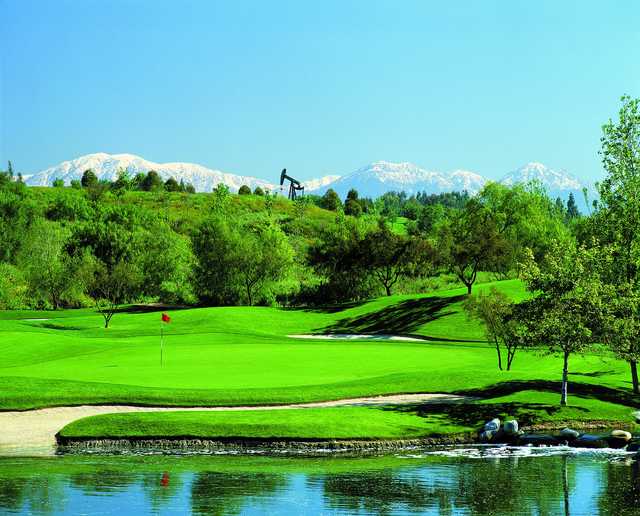 A view over the water of a hole at Coyote Hills Golf Club.