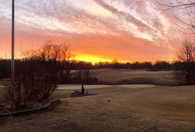 A sunset view of a tee at Drumm Farm Golf Club.