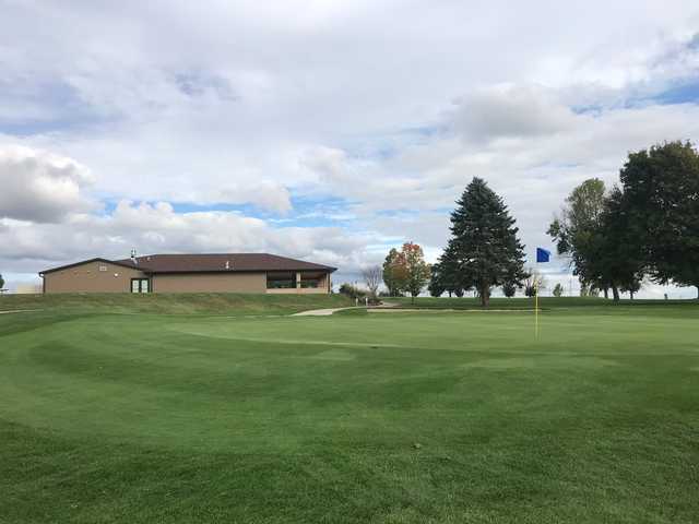 A view of a hole and the clubhouse at Sugar Maple Golf Club.