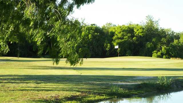 A sunny day view of a hole at Sinton Golf Course.