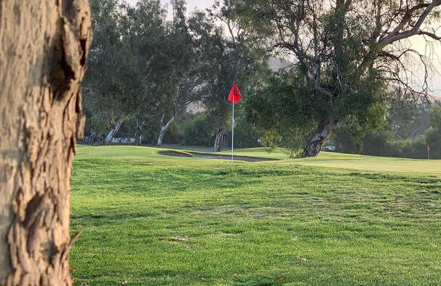 A sunny day view of a hole at Shandin Hills Golf Club.