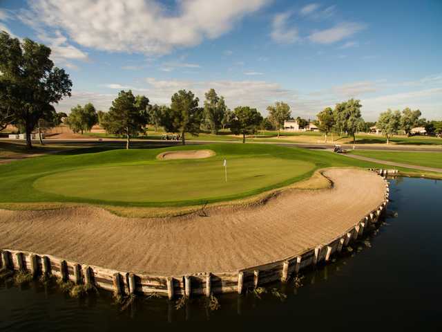 A view of a green with water and bunkers coming into play at Western Skies Golf Club.