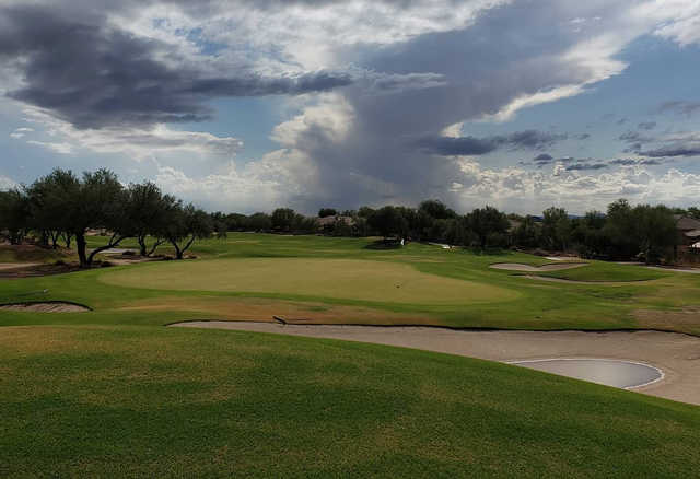 A cloudy day view of a hole at Terravita Golf Club.