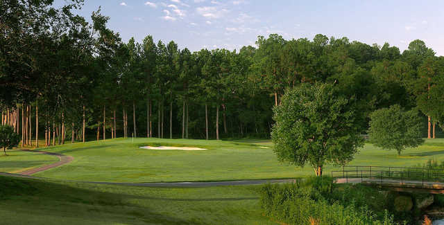 A sunny day view of a green at Cross Creek Country Club.