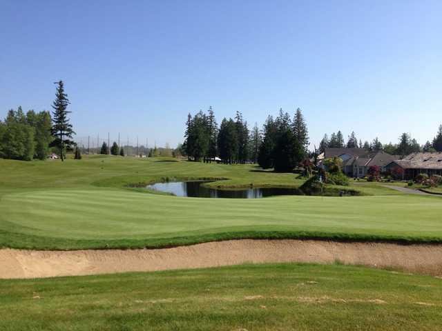 A sunny day view of a green at Gleneagle Golf Course.