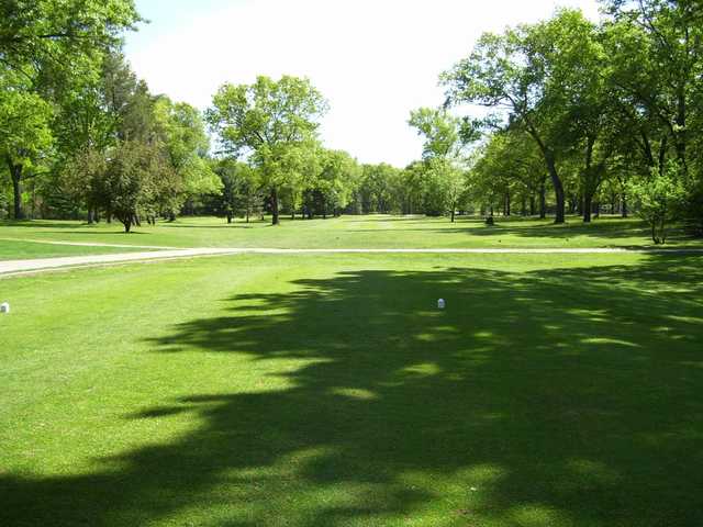 A sunny day view from a tee at Marquette Trails Golf Club.