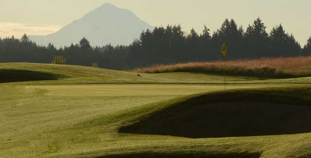 A sunny day view of a hole at Stone Creek Golf Club.