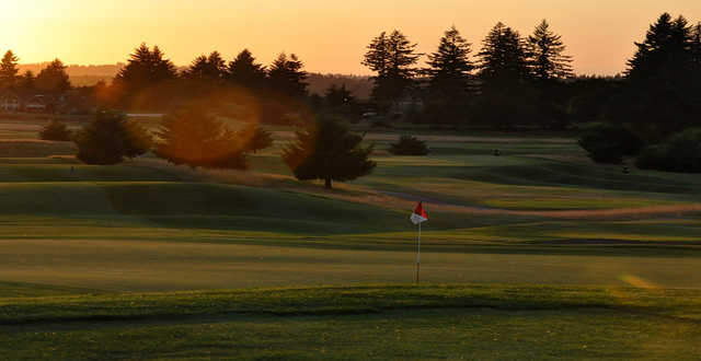 A sunset view of green #8 at Stone Creek Golf Club.