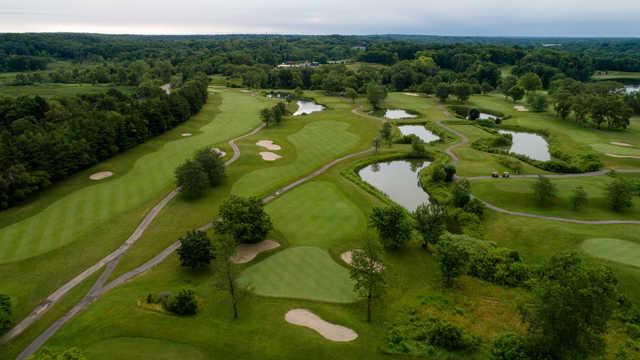 Aerial view of the 8th green and fairway with the 3rd fairway on the left side and the 7th tee on the right side.