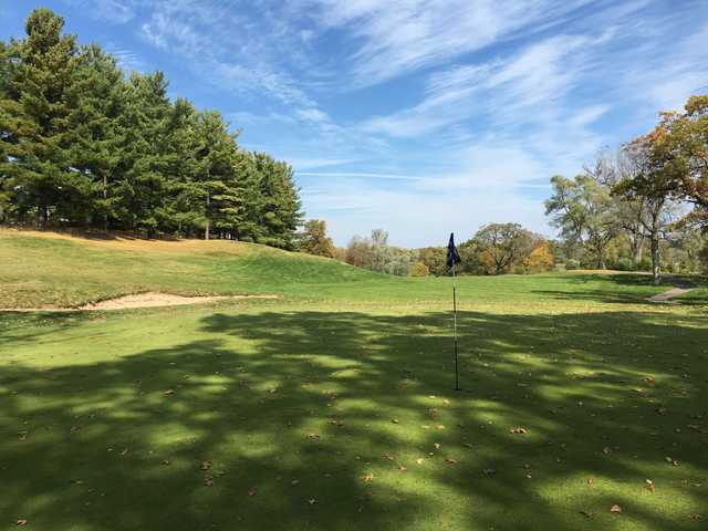 A fall day view of a hole at Mystic Creek Golf Club.