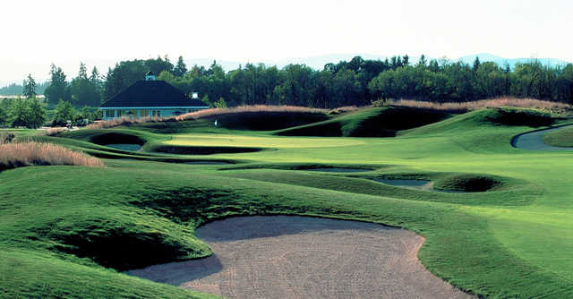 A view of a hole surrounded by bunkers at Pumpkin Ridge Golf Club.