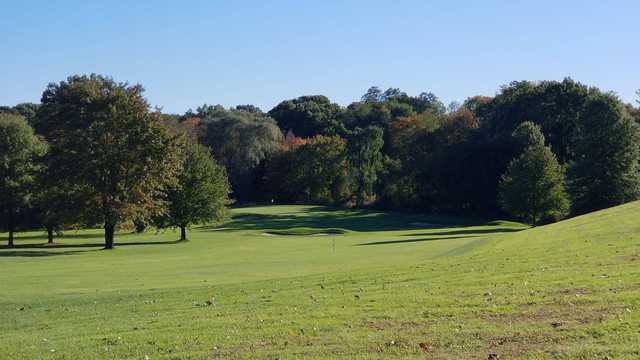 A sunny day view of a hole at Timberlin Golf Club.