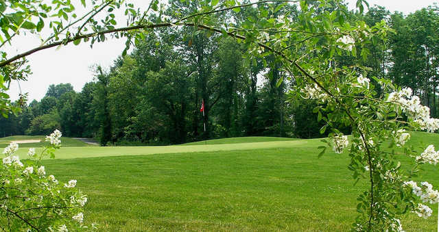 A spring day view of a green at Raritan Landing Golf Course.