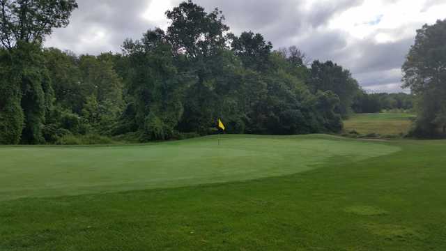 A cloudy day view of a hole at Raritan Landing Golf Course.