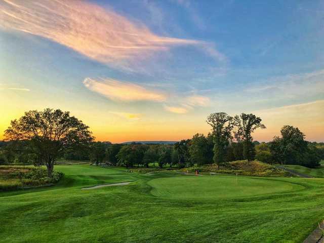 A sunset view of a hole at Galloping Hill Golf Course.