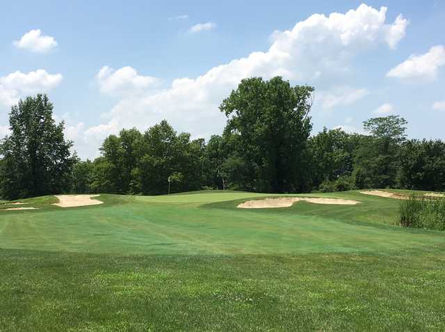 A view of a green flanked by bunkers at Foxfire Golf Club.