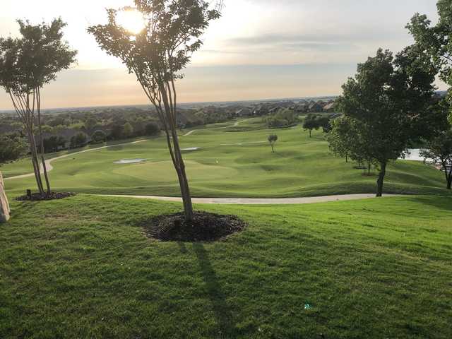 A sunny day view of a green from Wildhorse Golf Club of Robson Ranch.