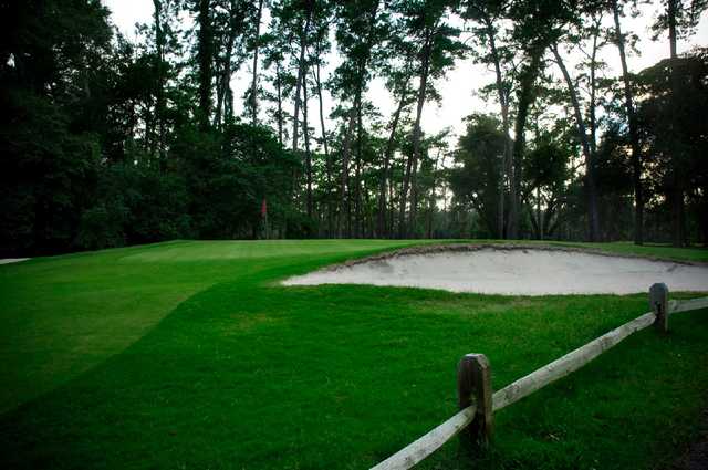 A view of a hole protected by sand traps at Hyde Park Golf Club