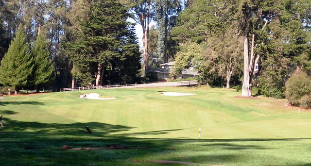A sunny day view of a green at Seascape Golf Club.