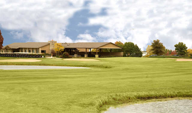 A view of a green and the clubhouse at Ives Grove Golf Links.