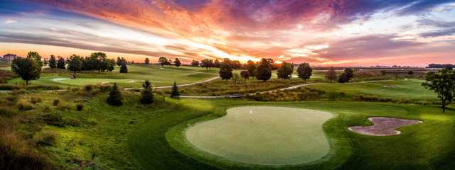 A sunset view of a hole at Otter Creek Golf Course.