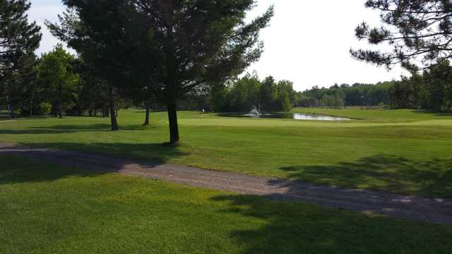 A sunny day view of a green at Gordon Pines Golf Club.