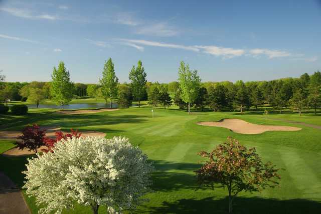 A spring day view of a hole at Pebble Creek Country Club.