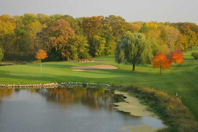 A view of a green with water coming into play at Pebble Creek Country Club.