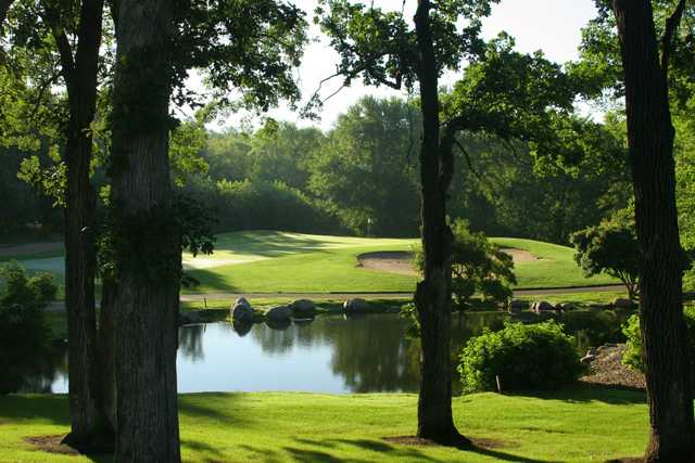 A view over the water of a hole at Pebble Creek Country Club.