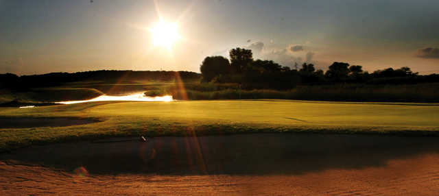 A sunny day view of a green at Wedgewood Cove Golf Club.