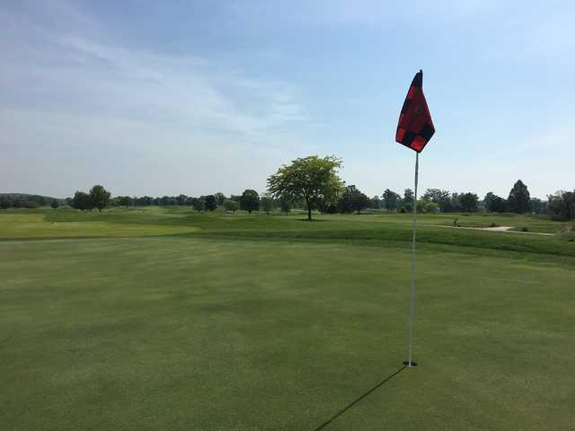 A sunny day view of a hole at Crown Pointe Golf Club.