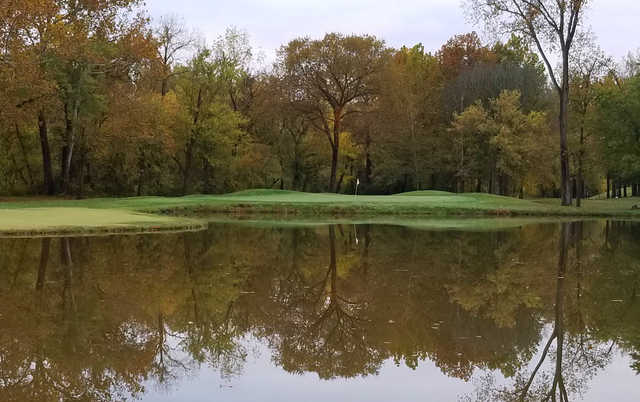 A fall day view of a hole at Fox Creek Golf Club.