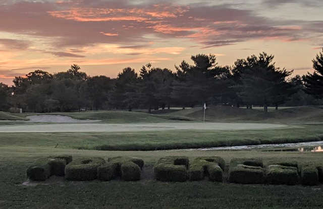 A sunset view of a hole at Fox Creek Golf Club.