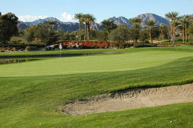 A sunny day view of a hole at Coral Mountain Golf Club.