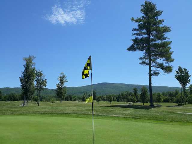 A sunny day view from a green at Ridgewood Country Club.