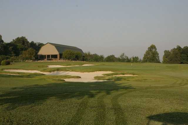A view of a green surrounded by tricky bunkers at Deer Lakes Golf Course.