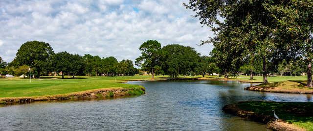 A view of a green with water coming into play at Belle Terre Country Club.