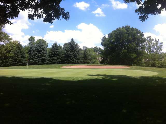 A sunny day view of a hole at Deerfield Golf Club.