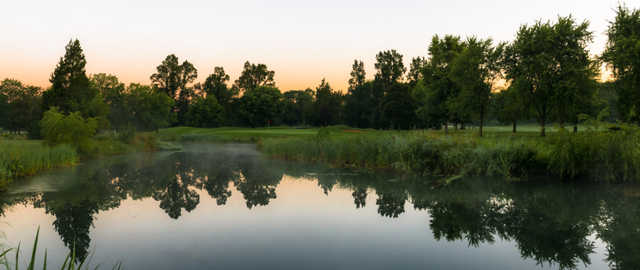 A view over the water of a hole at Deerpath Golf Course.